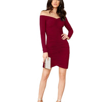Model pose in studio wearing the “Veins of Venus” maroon knit dress by Celestina.