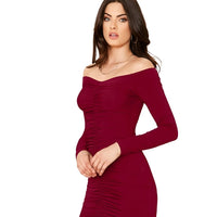 Studio side view of Celestina’s “Veins of Venus” maroon bodycon V neck dress.