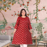 Front view: Maroon kurti against stone corridors at dusk
