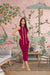 Model in maroon sleeveless dress with white lace – graceful front view