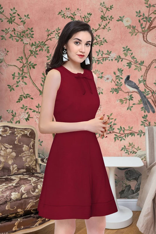 Model flaunting the Velvet Reign maroon sleeveless dress in styled background