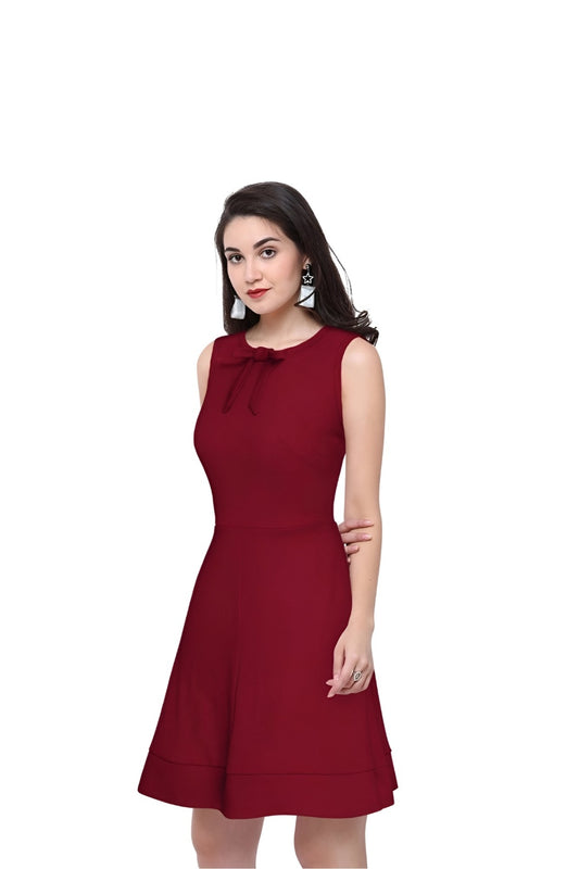 Model showcasing the maroon Velvet Reign dress from Celestina on plain background