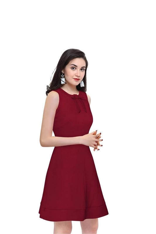 Side profile of Velvet Reign maroon sleeveless dress with clean backdrop