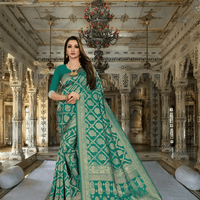 Green Kanjivaram silk saree glowing under temple light, gold threads catching firelight