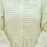  Garment pooled like spilled chemical poetry