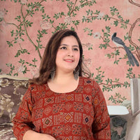 Front view: Dark green kurti glowing against a fiery background 🔥