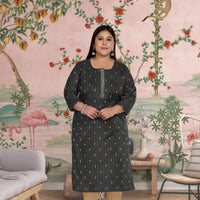 Front view: Black kurti with glowing embroidery under soft light