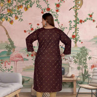 Rear angle highlighting flowing gold embroidery