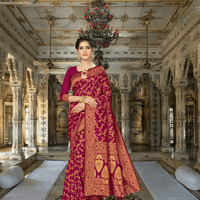 Light maroon Banarasi saree in golden hour, antique gold florals glowing warmly