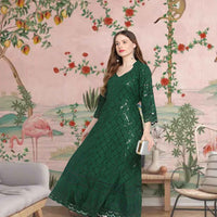 Front view: Dark green kurti against ancient trees