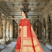 Close-up of zari butta motifs on red Banarasi silk fabric