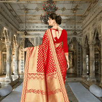 Detailed pallu view of red Banarasi saree with intricate gold weaving