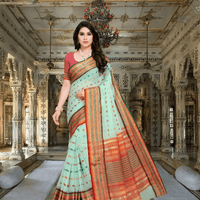 Pista green Kota Doria saree with pink and gold border styled in full front drape against palace interior