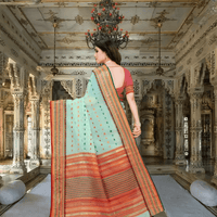 Graceful pallu in pink-gold weave flowing softly in a palace room setting