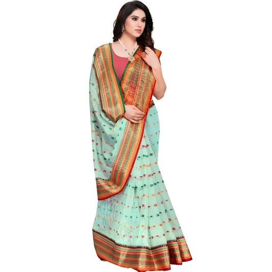 Studio shot of model in pista green saree with neatly pleated border