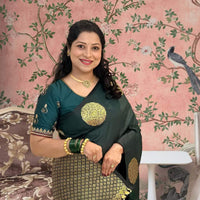 Front view of green printed silk saree in royal setting