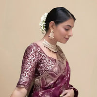 Close-up of embellished blouse glowing in palace lights