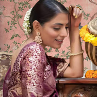 Left profile with radiant purple drape and gold work visible