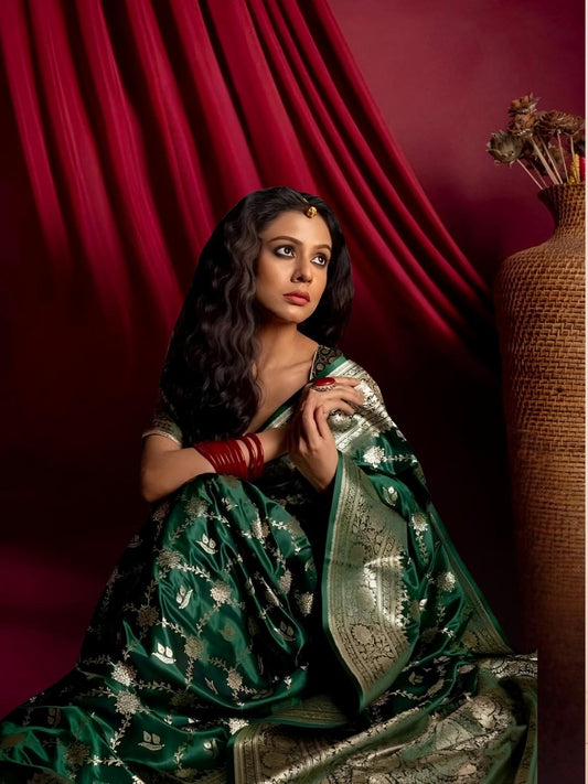 Model showcasing Zarqa Veil saree in an opulent palace setup
