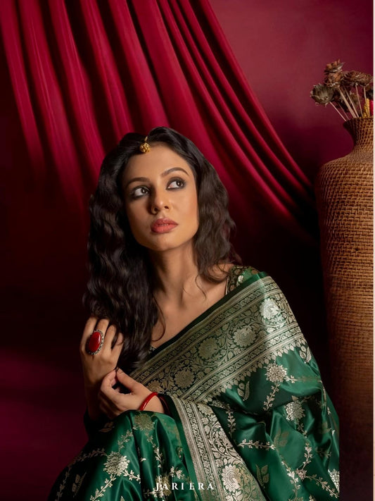 Model showcasing Zarqa Veil saree in an opulent palace setup