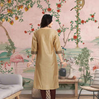 Rear shot showing flowing tunic grace