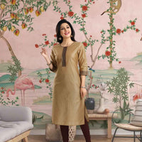 Front view: Beige kurti framed against golden dunes